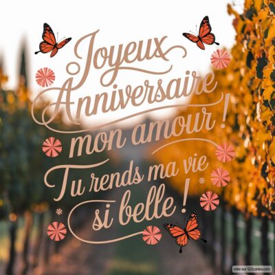 Carte d'anniversaire de mariage avec un message affectueux, entouré de motifs floraux et de papillons sur fond de vignes.
